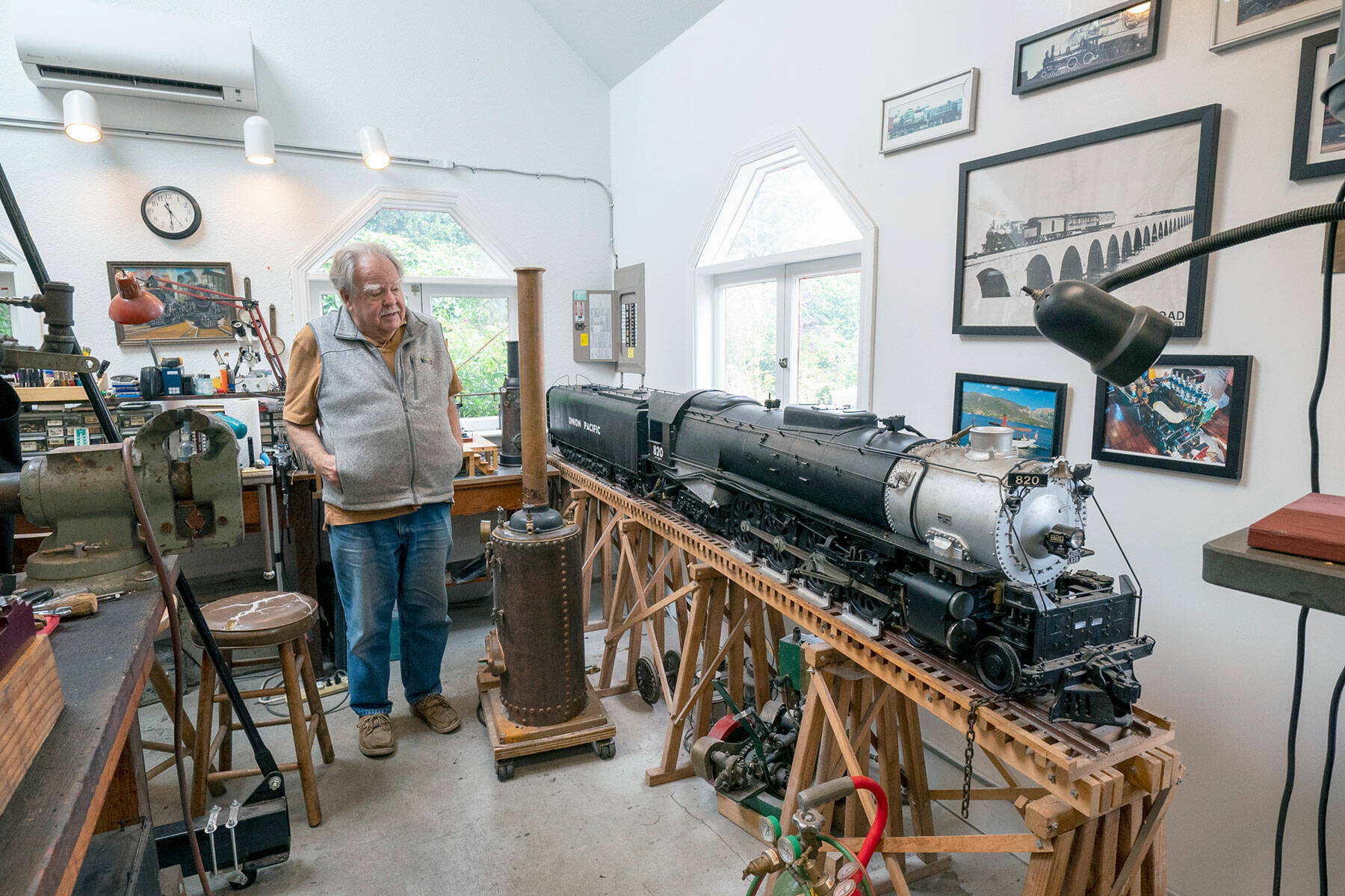 Jim Kunc, a Port Townsend resident and a retired North West Airlines pilot, proudly shows off the 1-inch scale model of a 1930s Union Pacific Northern train he built in his home shop. A lifelong train hobbyist, this model took 20 years to make. (Steve Mullensky/for Peninsula Daily News)