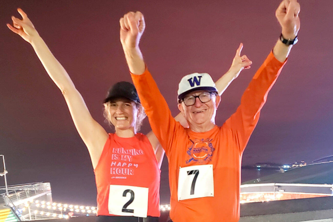 Courtesy photo
Alison Agness, left, and her father, Port Angeles' Bruce Skinner, celebrate after completing a marathon in Lima, Peru over Memorial Day Weekend. Skinner has now completed his goal of running marathons on all seven continents.