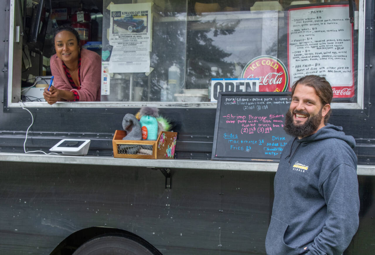 Charmaine and Caleb Messinger enjoy each other’s company as they operate the Southern Nibble, a South Carolina Lowland style food truck which serves food in locations around Sequim and Port Angeles. (Emily Matthiessen/Olympic Peninsula News Group)