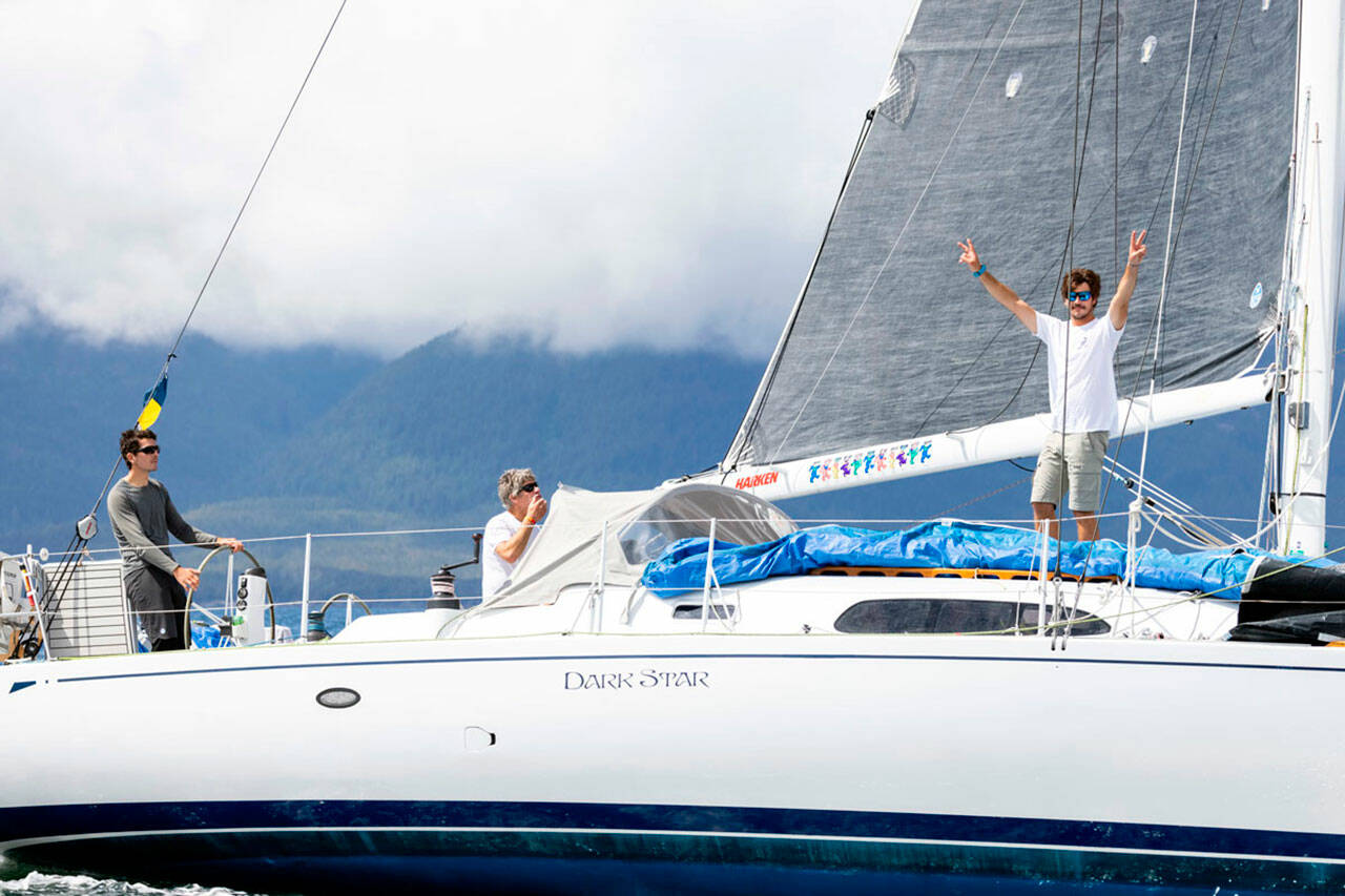 Team Pure and Wild, from left, Alyosha Strum-Palerm, Jonathan McKee and Matt Pistay, sail into Ketchikan’s Thomas Basin harbor Monday to win the 750-mile Race to Alaska. (Thomas Hawthorne)