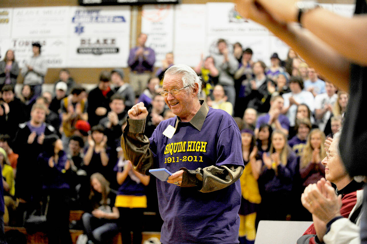 Michael Dashiell / Olympic Peninsula News Group file
Myron Teterud, a longtime Sequim schools and community supporter, gives the crowd a salute after being honored as “Fan of the Century” at Sequim High School’s centennial celebration in January 2011. Sequim School Board directors agreed to name the SHS athletic field in honor of Teterud, along with naming the stadium <strong>stáʔčəŋ</strong>, a S’Klallam word meaning “wolf.”