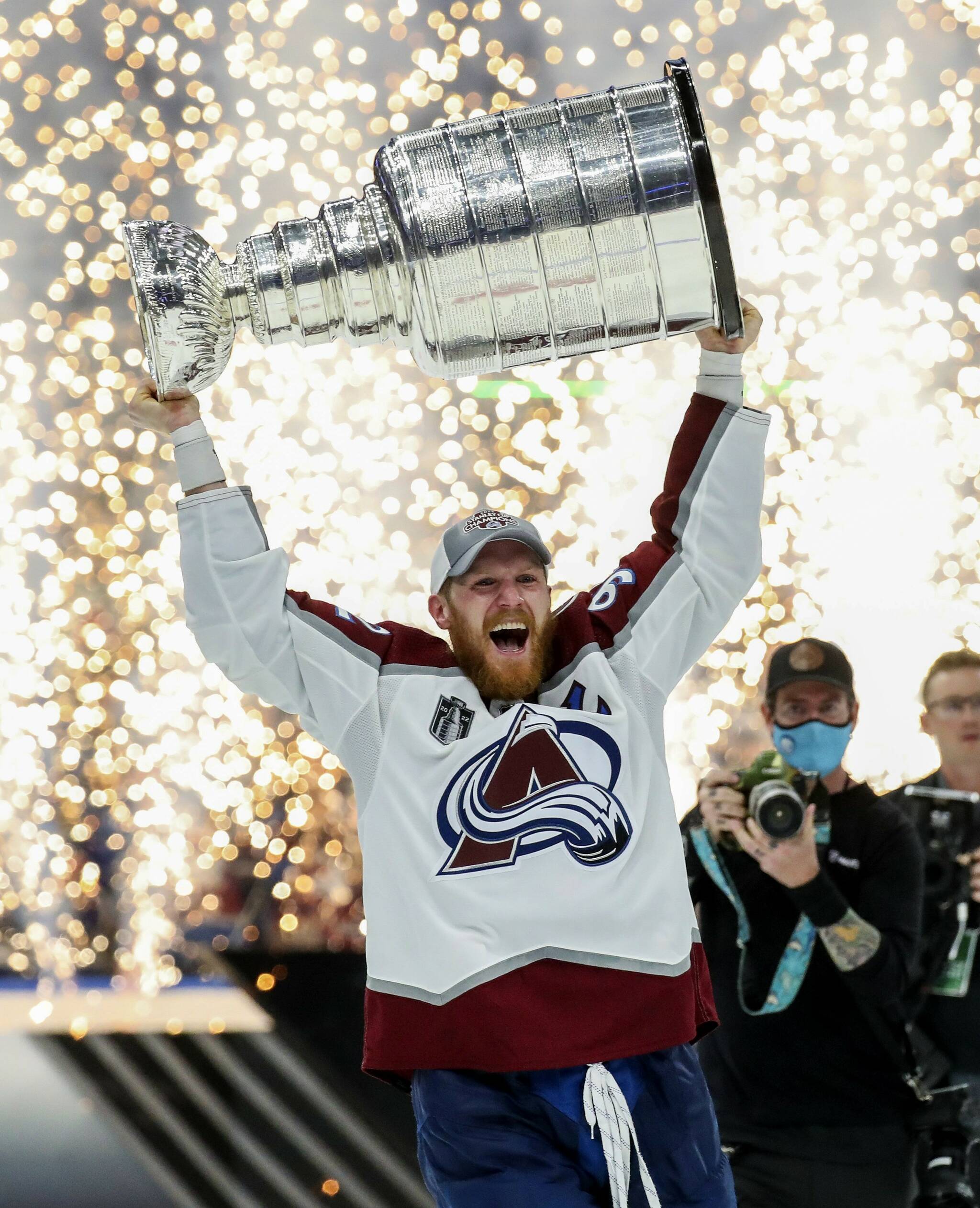 Colorado Avalanche left wing Gabriel Landeskog (92) holds the Stanley Cup after the Avalanche defeated the Tampa Bay Lightning 2-1 in Game 6 of the NHL hockey Stanley Cup Finals on Sunday in Tampa, Fla. (Dirk Shadd/Tampa Bay Times via AP)