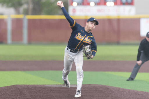 Forks pitcher Logan Olson releases a pitch against Adna in the District 4 quarterfinals at Shelton High School May 7.