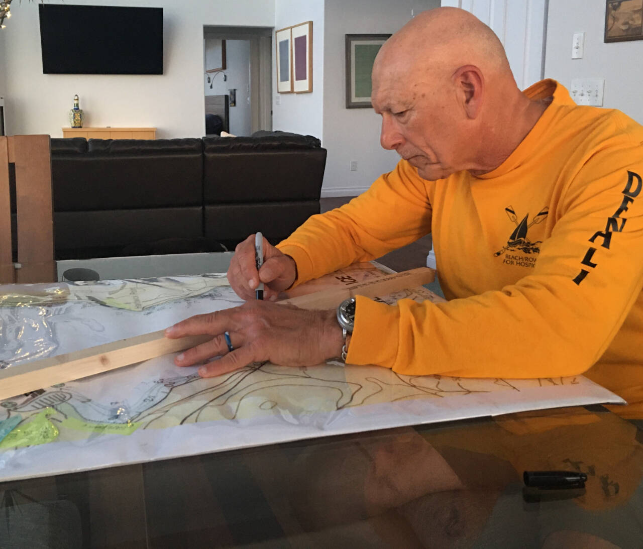 Frank DeSalvo, Sequim Bay Yacht Club commodore and co-chair of the club’s rowing and paddling fundraiser for Volunteer Hospice of Clallam County, outlines the new 8-kilometer course for the Sept. 17 race. (Carolyn DeSalvo)