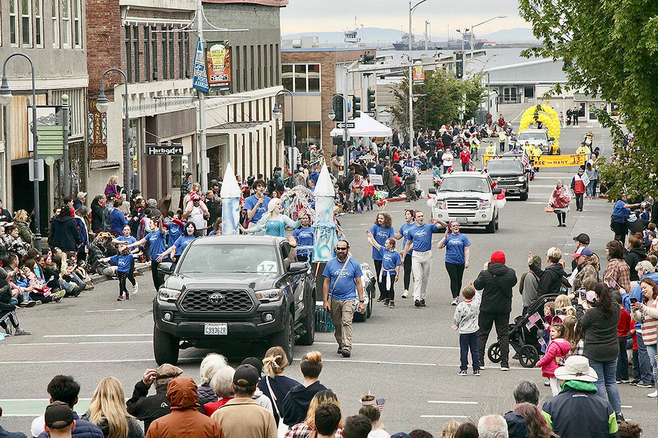 The Fourth of July parade travels south on Laurel Street in downtown Port Angeles on Monday. The parade lasted an hour and was well attended despite threatening skies. (Dave Logan/for Peninsula Daily News)