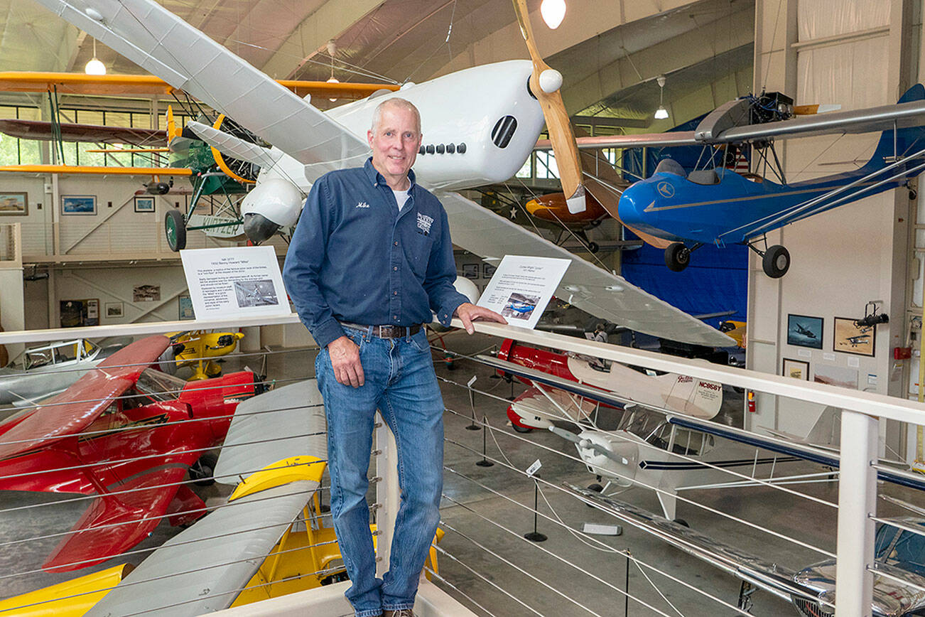 Steve Mullensky/for Peninsula Daily News

Michael Payne, Executive Director of the Port Townsend Aero Museum, shows off some of the antique and historic air planes on display at the museum located at the Jefferson County International Airport in Port Townsend. The museum is expanding, in the area behind the blue tarp in the background, to increase the museum’s display area by about a third.