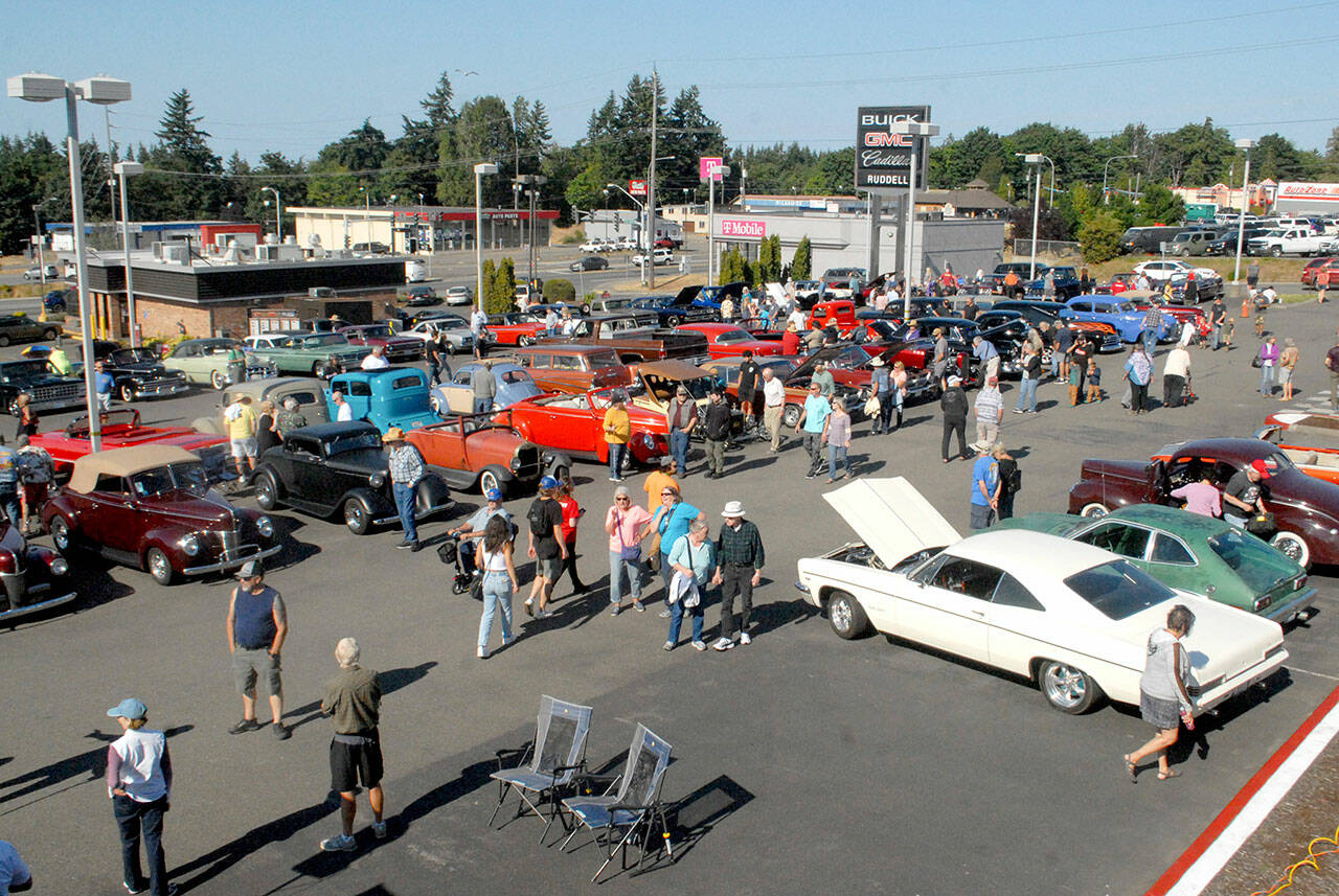 Vintage cars stand on display at the 2021 Ruddell Cruise-In at Ruddell Auto Plaze in Port Angeles. (Keith Thorpe/Peninsula Daily News)
