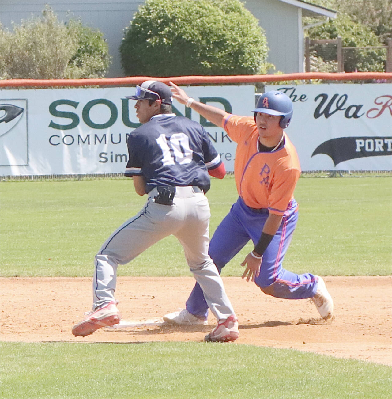 The Lefties’ Jadon Arakaki is safe at second base as Bellingham Bells shortstop Christopher Campos is late with the throw and tag. (Dave Logan/for Peninsula Daily News)