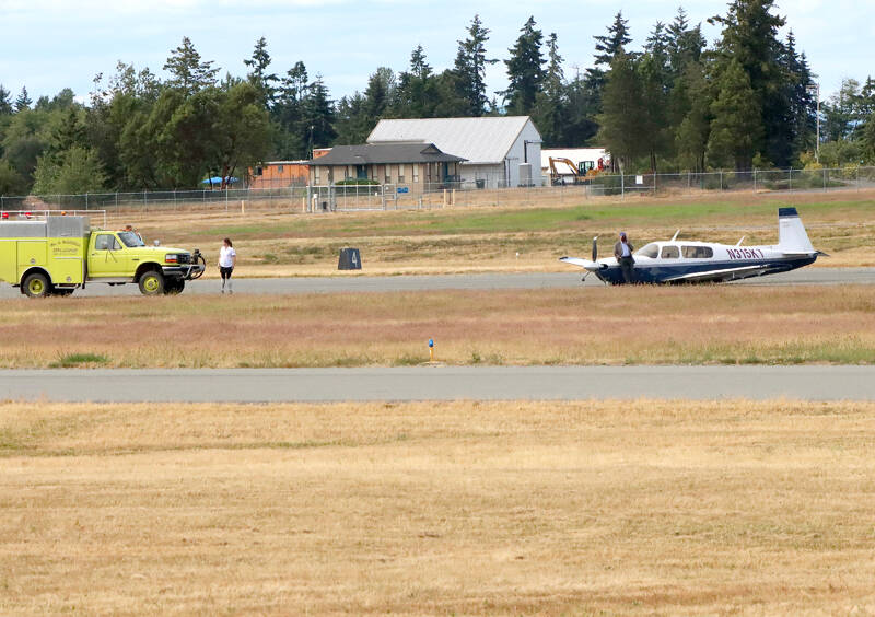 A pilot crash landed his plane on the runway Sunday at William R. Fairchild International Airport. There were no injuries. (Dave Logan/for Peninsula Daily News)