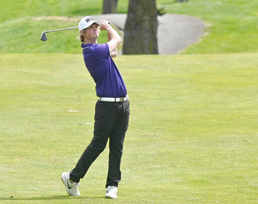 Sequim’s Ben Sweet watches his iron shot during a match with North Kitsap this spring. Sweet has been named the Peninsula Daily News’ All-Peninsula Golf MVP. (Michael Dashiell/Olympic Peninsula News Group)