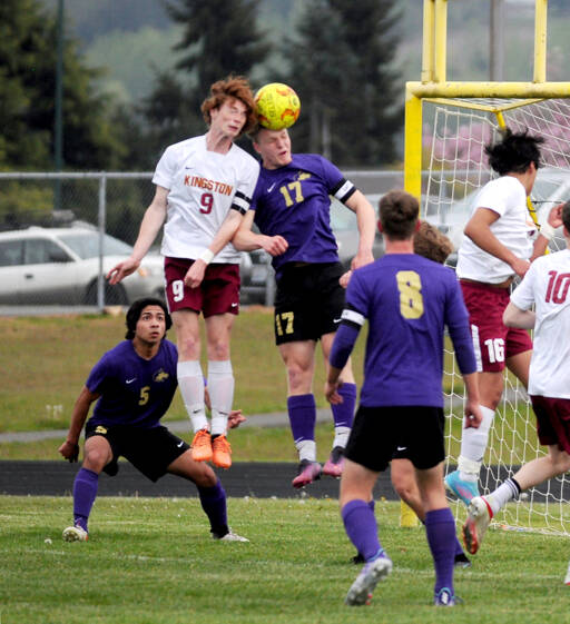Sequims Aidan Henninger, right, vies for a header with a Kingston defender during a game in April. (Michael Dashiell/Olympic Peninsula News Group)