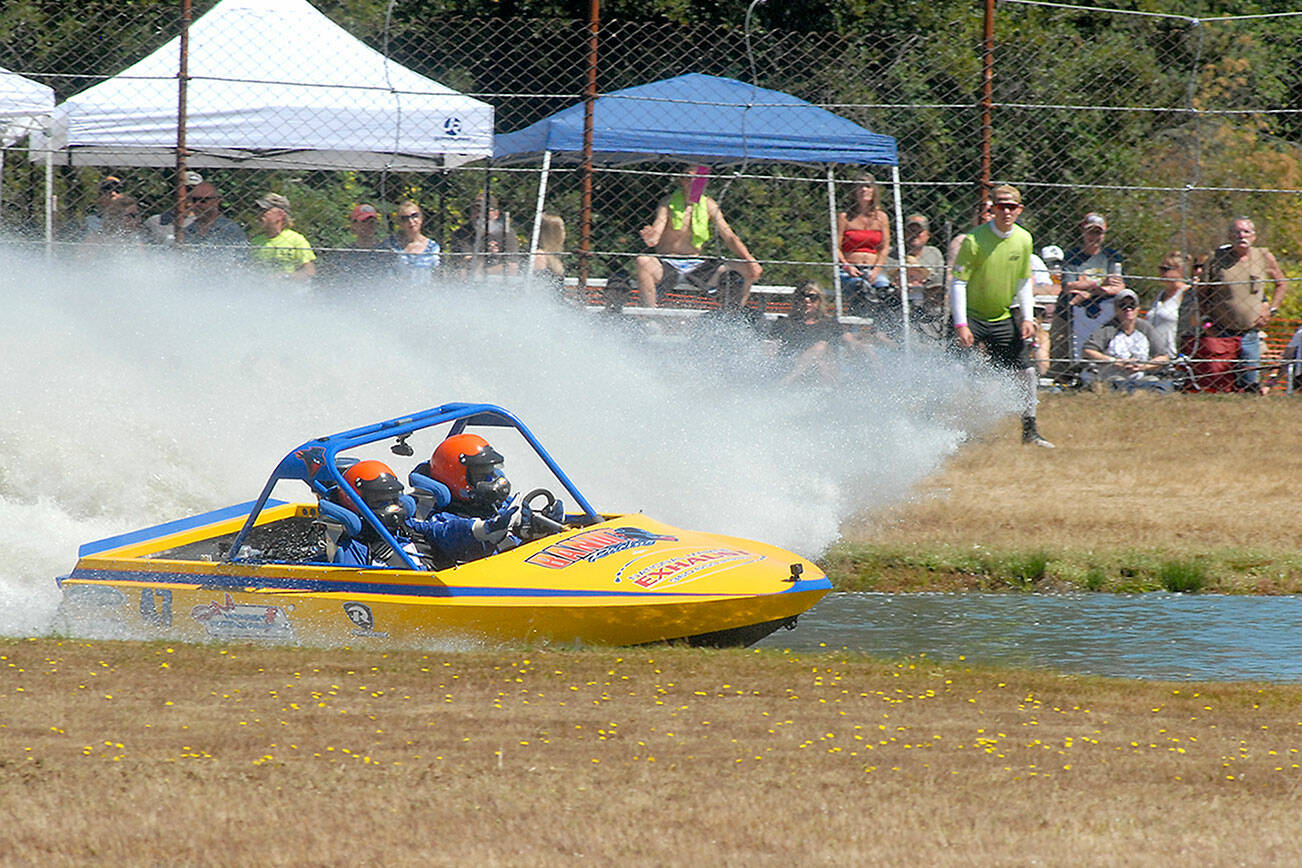 Keith Thorpe/Peninsula Daily News
Driver Darrin Swindahl and navigator Ashley Swindahl  of the Bandit Sprint Boat team compete on Saturday at Extreme Sports Park in Port Angeles.