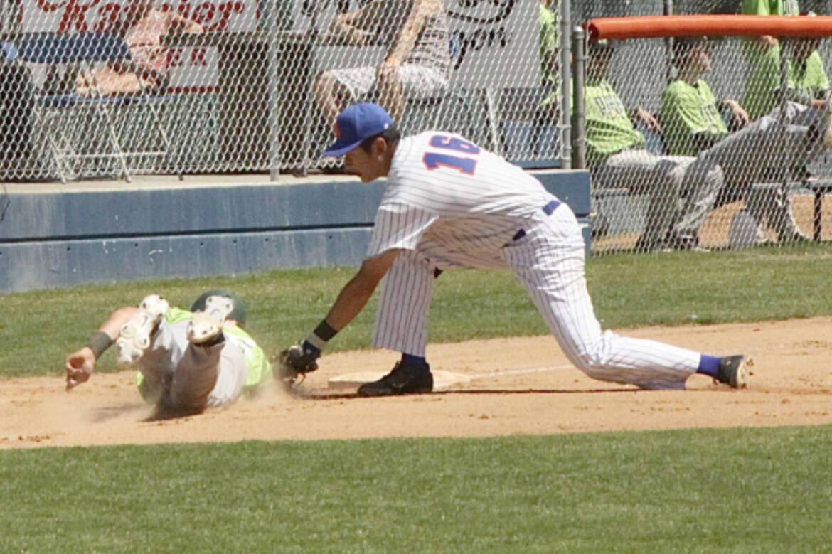 Lefties' third baseman BY Choi, tags out Yakima Valley baserunner Spencer Shipman who wandered too far off third. Choi took the snap throw from catcher Danny Briones. (Dave Logan/for Peninsula Daily News)