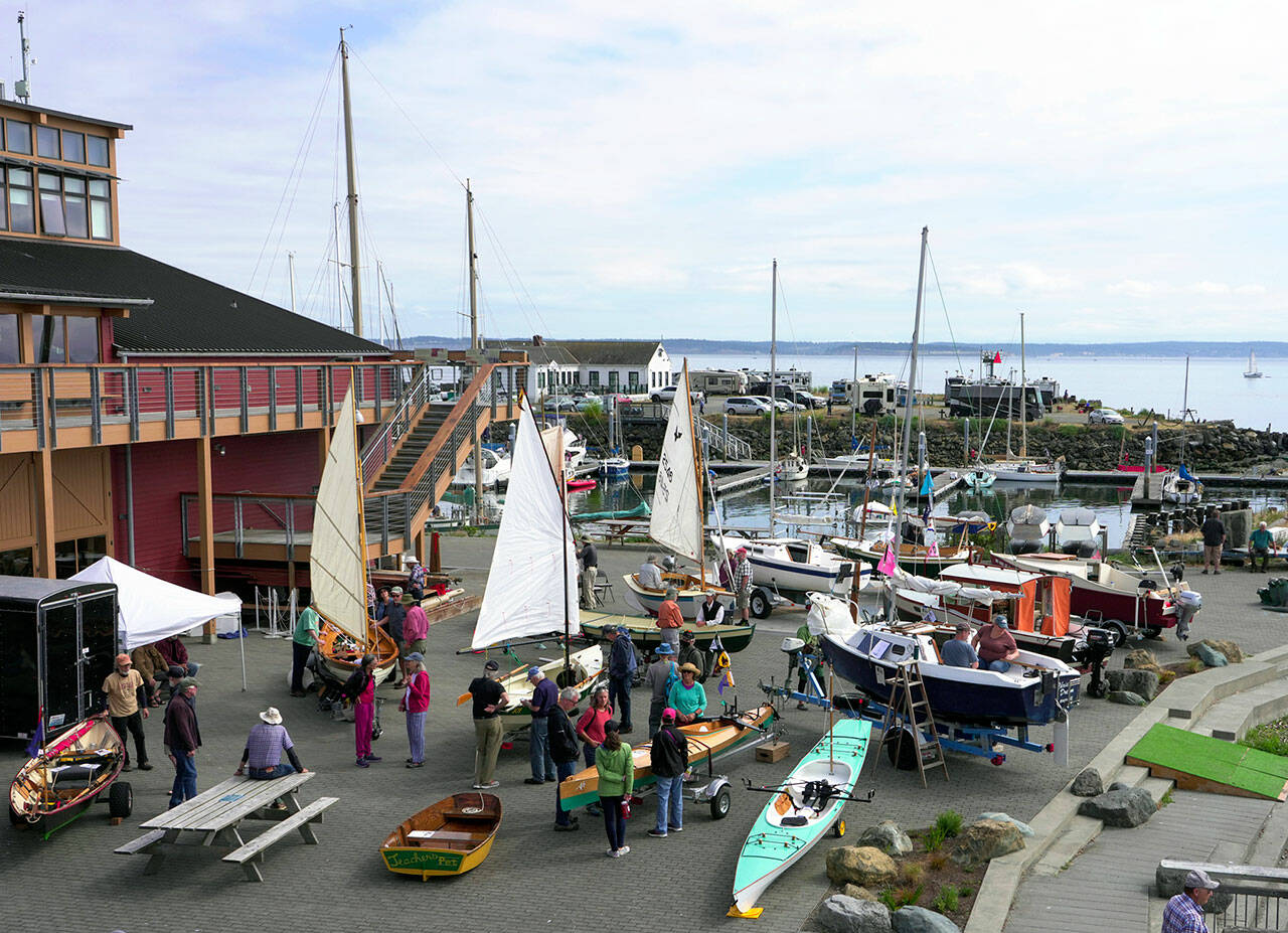 Several of the 50 registered pocket yachts were on display during the Port Townsend Pocket Yacht Palooza at the Northwest Maritime Center First Fed Waterfront Commons on Saturday. Billed as the largest exhibit of small craft in North America, the one-day show attracts small, trailerable boats from around Puget Sound. Any boat of 20 feet or less could be considered a pocket yacht. (Steve Mullensky/for Peninsula Daily News)
