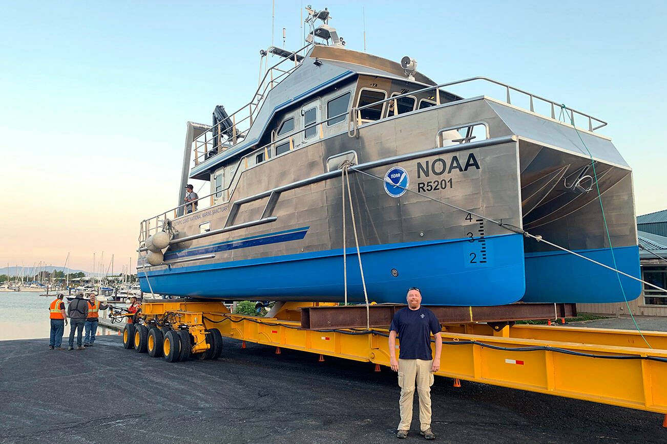 Sanctuary Superintendent Kevin Grant is in the foreground at a 2021 boat launching in Bellingham. (NOAA)