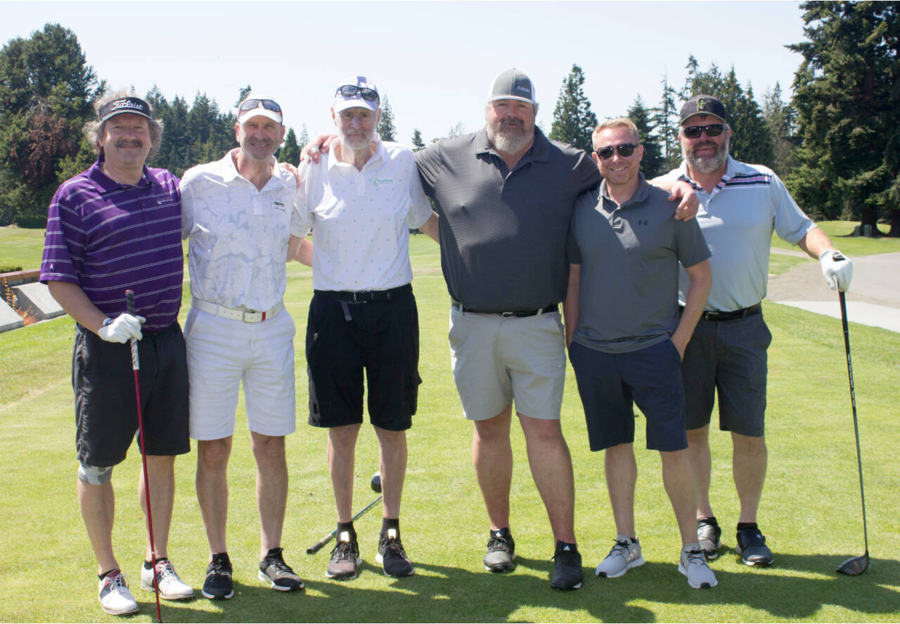 A team from Sequim Health and Rehabilitation won the 11th annual Sonny Sixkiller UW Huskies Celebrity Classic at Cedars at Dungeness this weekend. From left, Mark Mitrovich, Michael Littman, former Husky celebrity John Buller, Curtis Rose, Sequim Health and Rehabilitation CEO Jason Segar and Sid Krumpe. (Courtesy photo)