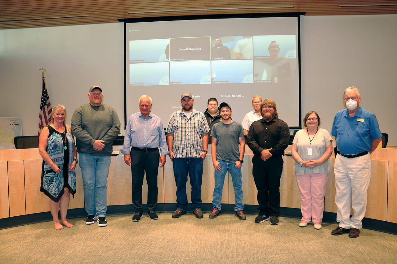 Pictured, in the front row, left to right, are Vicki Lowe, John Christenson, Mayor Tom Ferrell, Robert Whalen, Timmy Wright, Michael Latimer, Kathy Downer, Lowell Rathbun. The back row, on left is Brandon Janisse and, on the right, William Armacost.