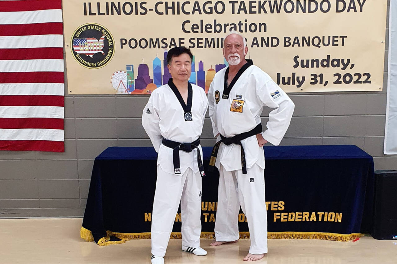 Courtesy photo
Port Angeles' Robert Nicholls with Jo Jah Oh, head technical director from the taekwondo world headquarters in South Korea at the Chicago Taekwondo Day celebration.