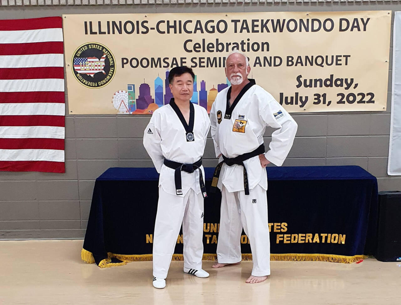 Port Angeles’ Robert Nicholls with Jo Jah Oh, head technical director from the taekwondo world headquarters in South Korea at the Chicago Taekwondo Day celebration. (Courtesy photo)