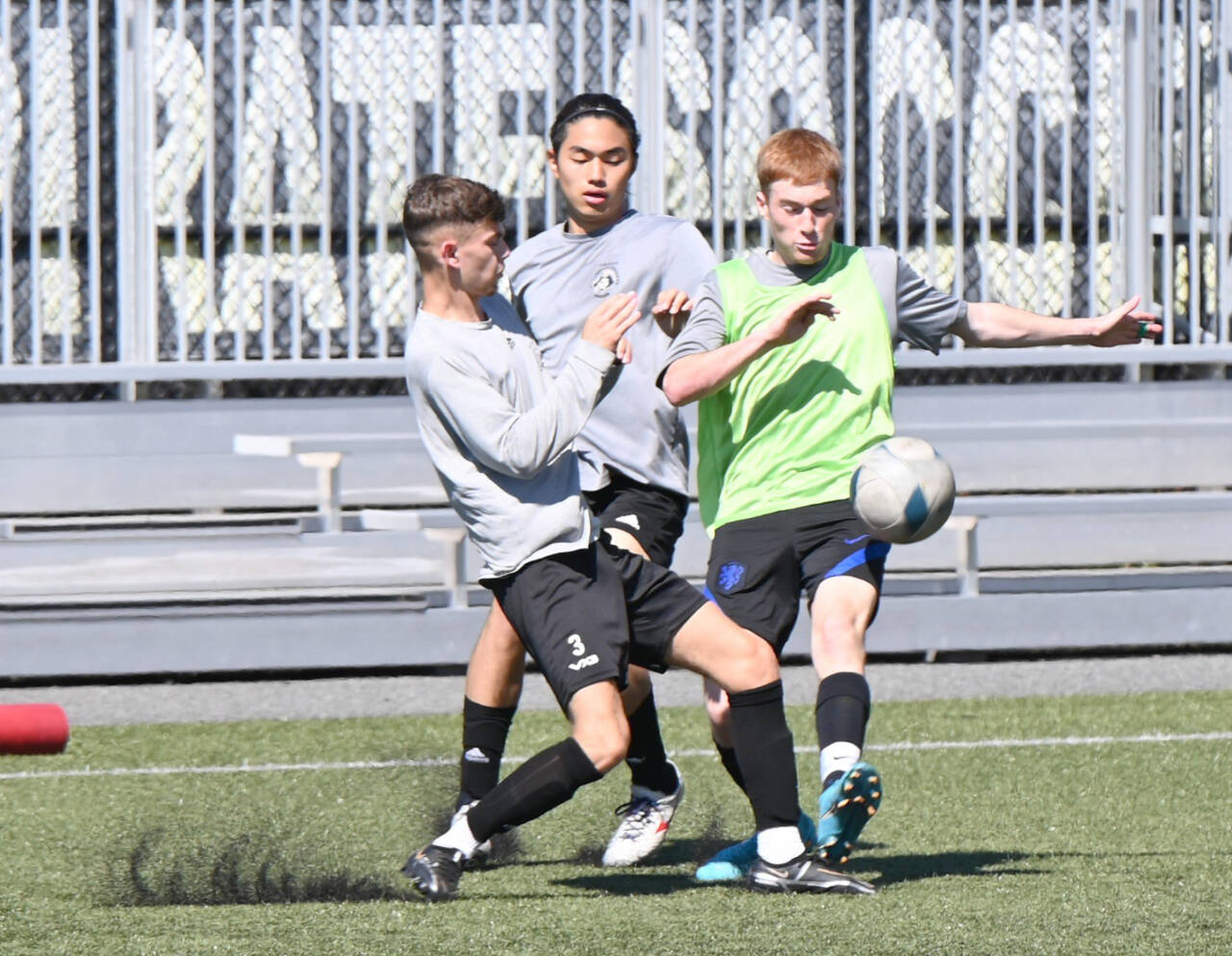The Peninsula College men’s team also began practice Monday. From left, Alfie Tucker, Shu Kato and Pipeijn Van Der Ende fight for a loose ball at Wally Sigmar Field in Port Angeles. (Photos courtesy of Peninsula College)