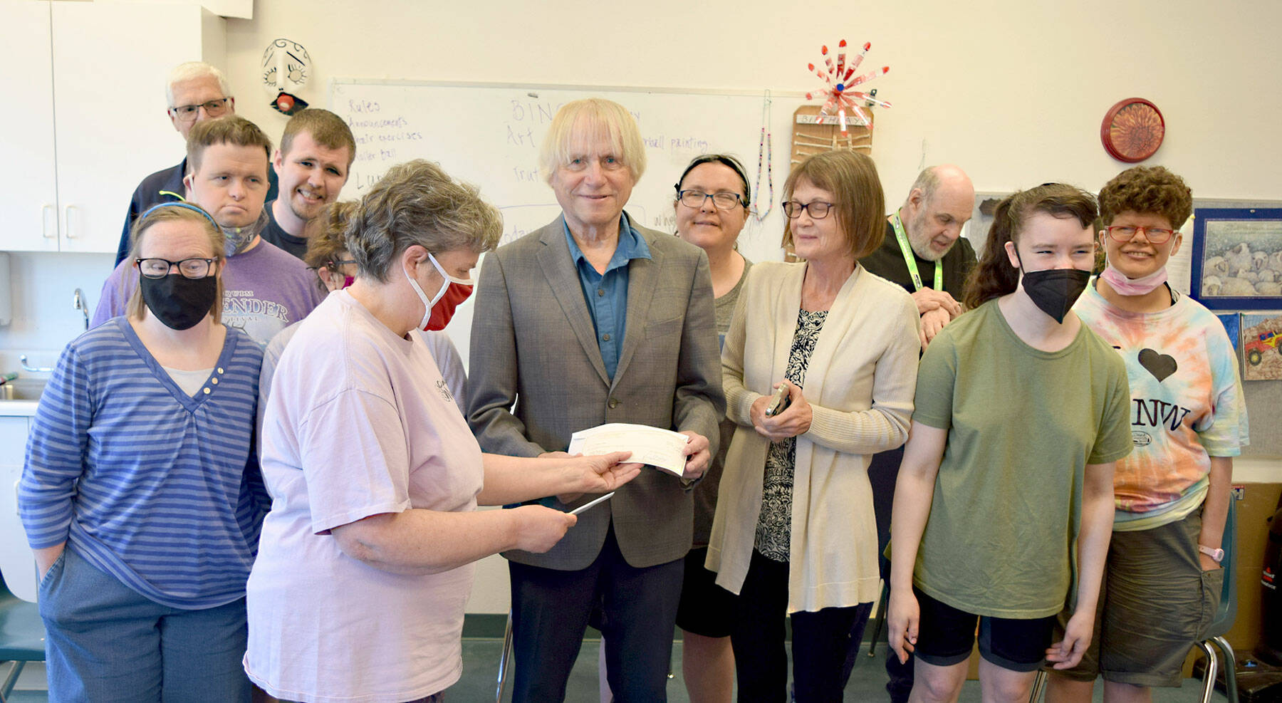 Pictured in the front row, left to right are Ruthie Brandt, Beth Walker, Homer Smith, Cynthia McNulty and Crissy Gelderd. In the middle row, from left to right, Spencer Hay, Andrew Nichol, Kira Kersting (hidden), Mandy Bingham, Stacey Shipley and Violet Snodgrass. George Will, Clallam Mosaic instructor and community engagement coach, is in the back. (Photo by Catherine McKinney)