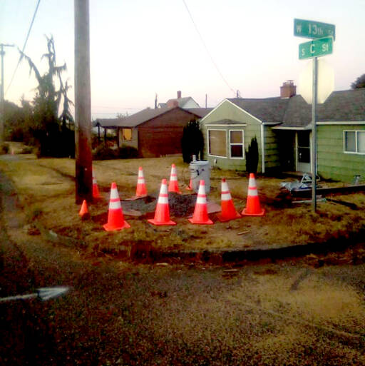 The driver of a stolen Toyota Camry crashed into a utility pole at 13th and C streets in Port Angeles at 7:45 a.m. on Saturday, knocking out power in the area for six hours. (Brian Gawley/Peninsula Daily News)