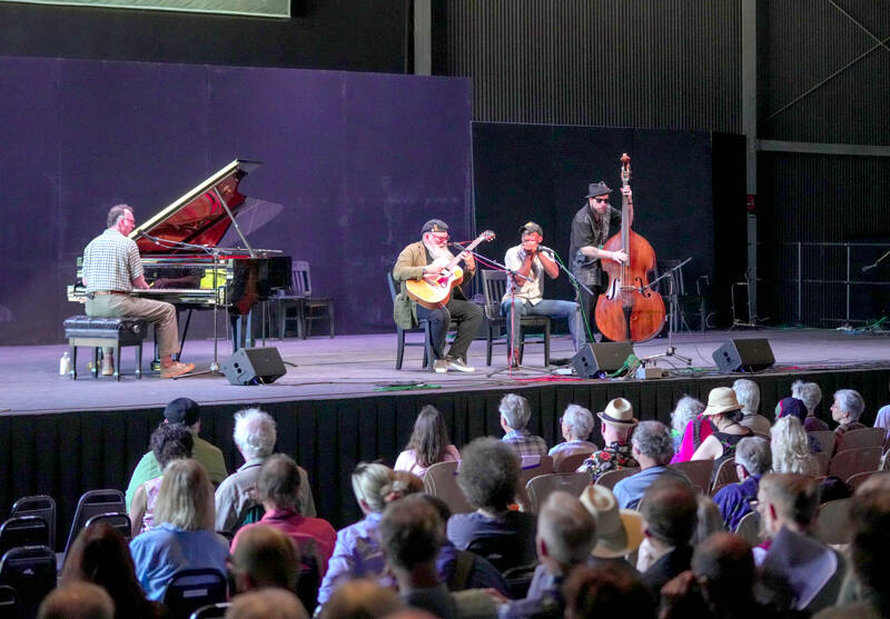 Centrum Acoustic Blues faculty, from left, Carl Leyland, Rodrigo Mantovani, Andrew Alli and Jimmy Vivino play a set during the Acoustic Blues Showcase at McCurdy Pavilion on Saturday. (Steve Mullensky/for Peninsula Daily News)