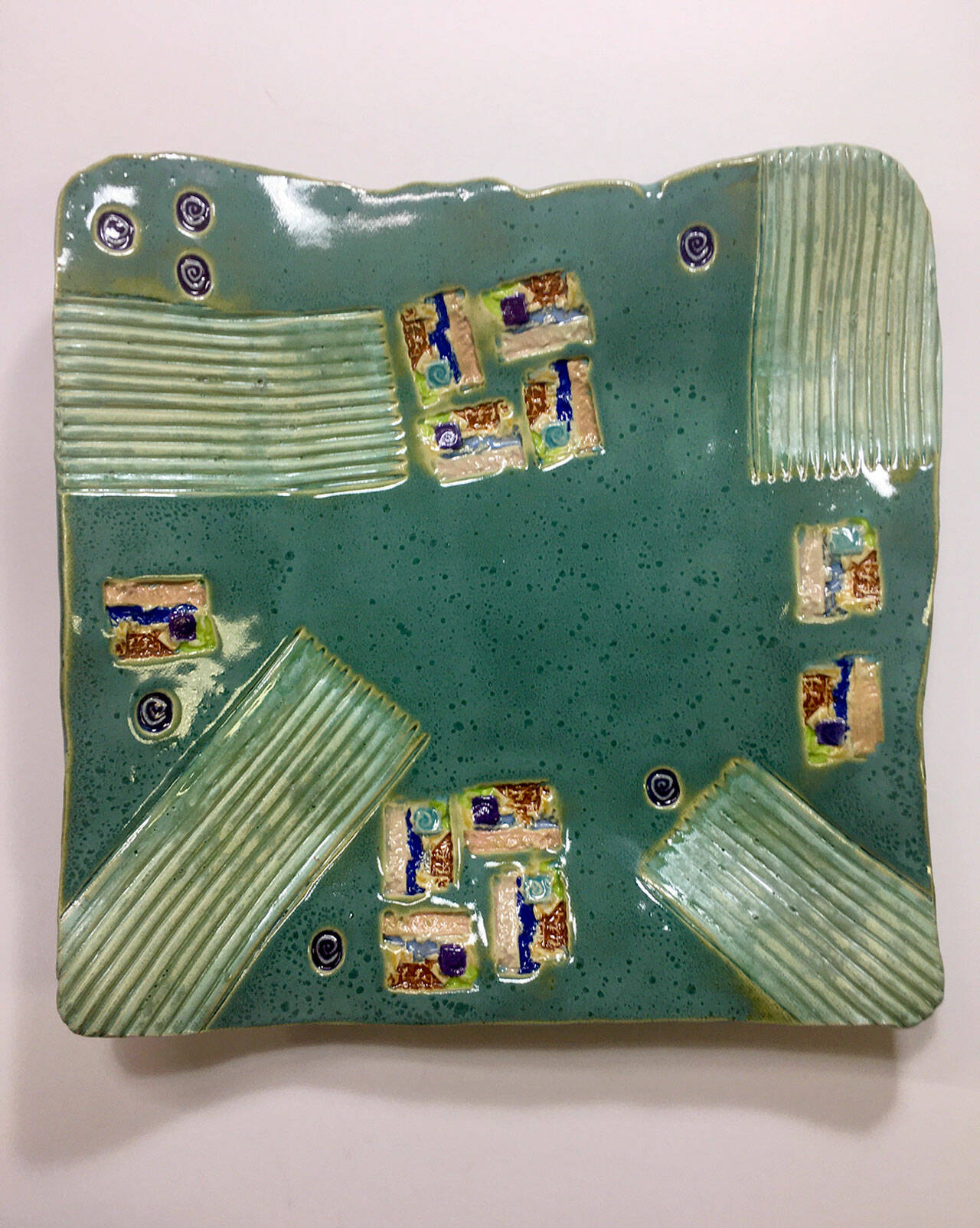 Functional ceramics, like this plate, created by Barbara Ewing are exhibited at Port Townsend Gallery.