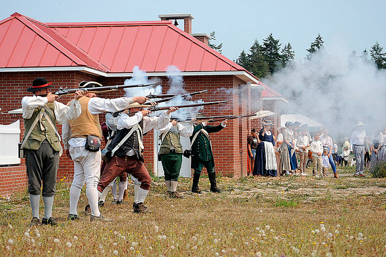 Matthew Nash/Olympic Peninsula News Group

Colonial soldiers shoot at the British in a skirmish reenactment during the Northwest Colonial Festival in 2021. It returns for four days today through Sunday with skirmishes and demonstrations at the George Washington Inn.