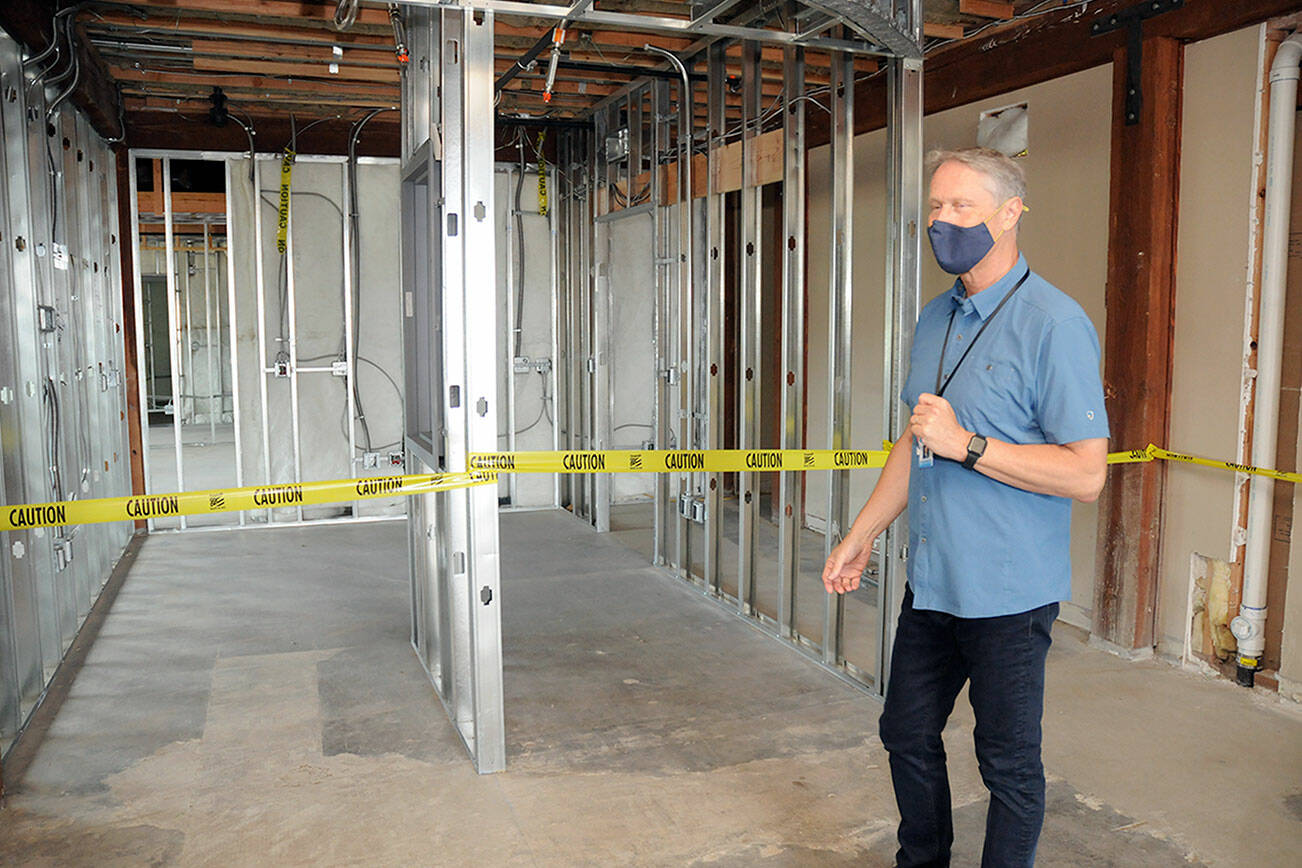 Dr. Michael Maxwell, CEO of the North Olympic Healthcare Network, conducts a short tour of the organization’s future Eastside Health Center at 1026 E. First St. in Port Angeles during an open house on Saturday. The clinic, located in the former Edna’s Place building, will house medical services and administrative offices with an opening scheduled for late December. (Keith Thorpe/Peninsula Daily News)