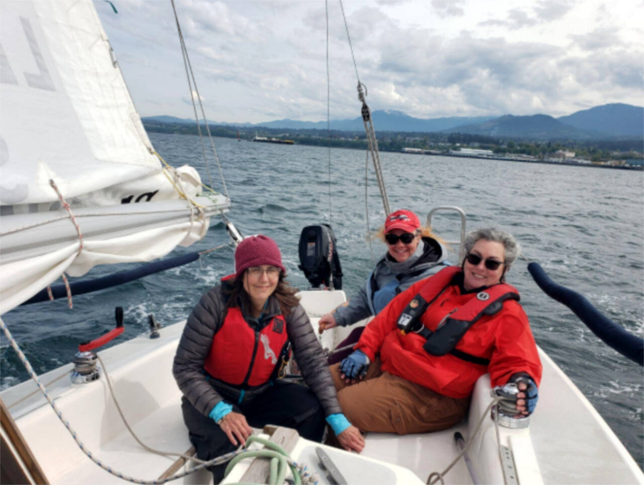 From left, students Theresa Tetreau, Karena Stocket and Kelly-Anne Kirk on the water as part of the Community Boating Program’s women’s sailing program. (Courtesy photo)