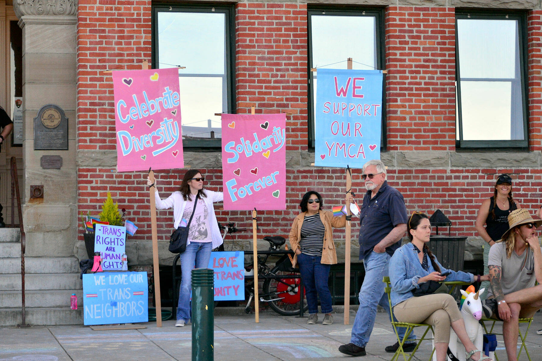 Supporters of transgender rights gathered in front of Port Townsend City Hall on Monday during a city council meeting when a proclamation was read stating the city is a welcoming place for transgender people. An 80-year-old woman’s ban from the local swimming pool following a confrontation with a transgender woman in the locker has received national attention, and people on both sides of transgender issues traveled to Port Townsend to show their support for their respective sides. (Peter Segall / Peninsula Daily News)