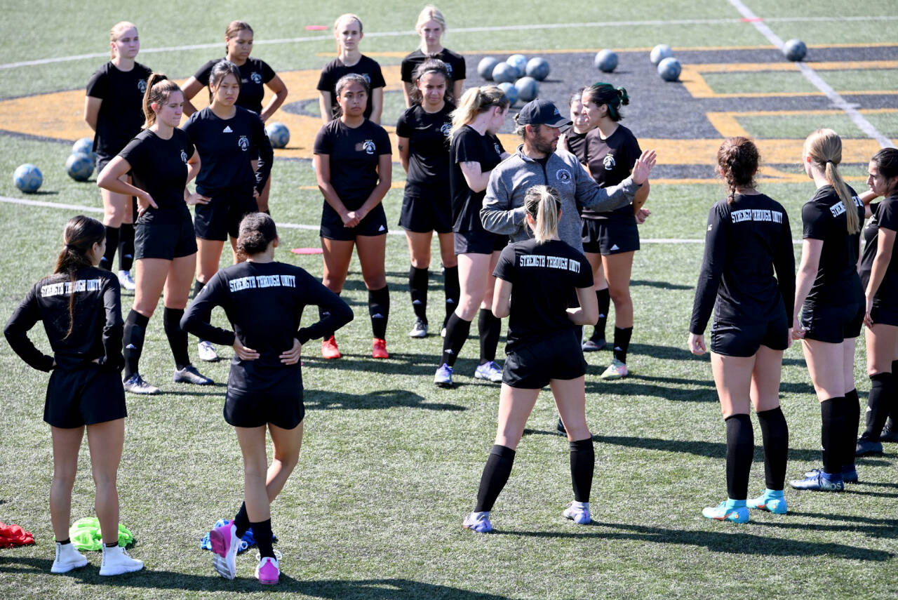 Coach Kanyon Anderson works with members fo the Peninsula College women’s soccer team at a practice earlier this month. The women are defending NWAC champions. (Photo courtesy of Peninsula College)