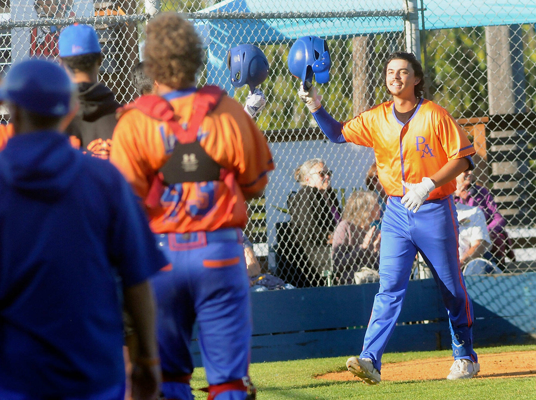 Lefties designated hitter Riley Parker tips his helmet at his teammates after rounding the bases with a solo homer in the first inning on Thursday night at Port Angeles Civic Field. (Keith Thorpe/Peninsula Daily News)