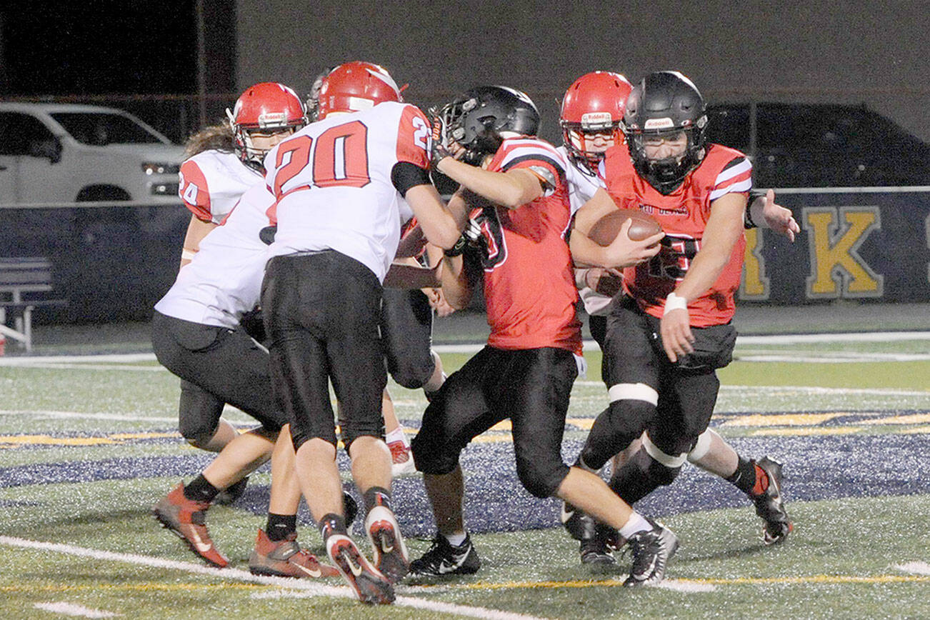 Lonnie Archibald/for Peninsula Daily News
Neah Bay senior Julian Carrick looks for running room during a 2021 game against Mossyrock. Carrick is once again expected to start at quarterback and in the secondary for the Red Devils this season.