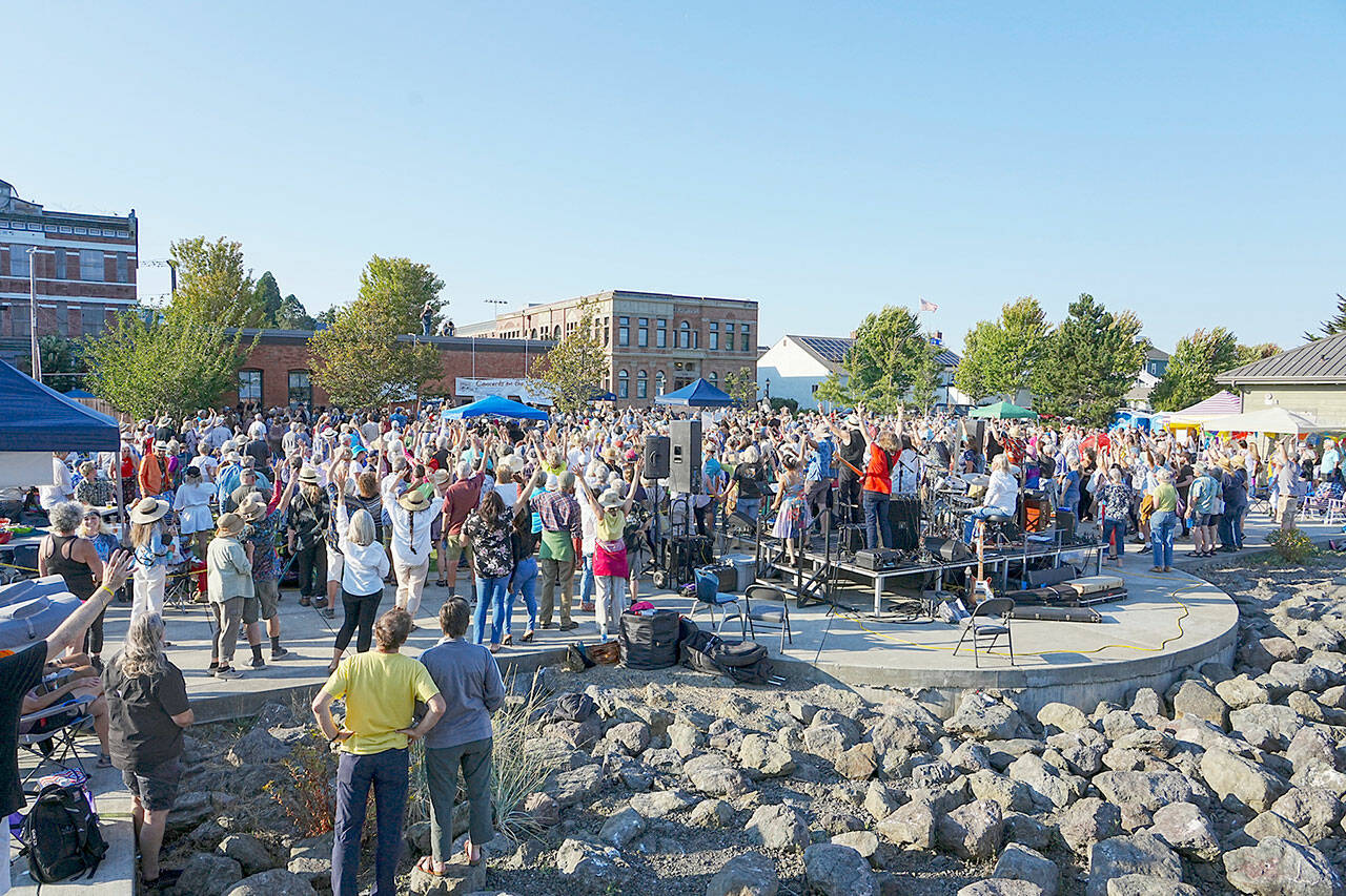 Several hundred people assembled at Pope Marine Park on Thursday for the final Concert on the Dock presented by the Port Townsend Main Street Association but also, for a Community Portrait that happened during intermission. (Steve Mullensky/for Peninsula Daily News)