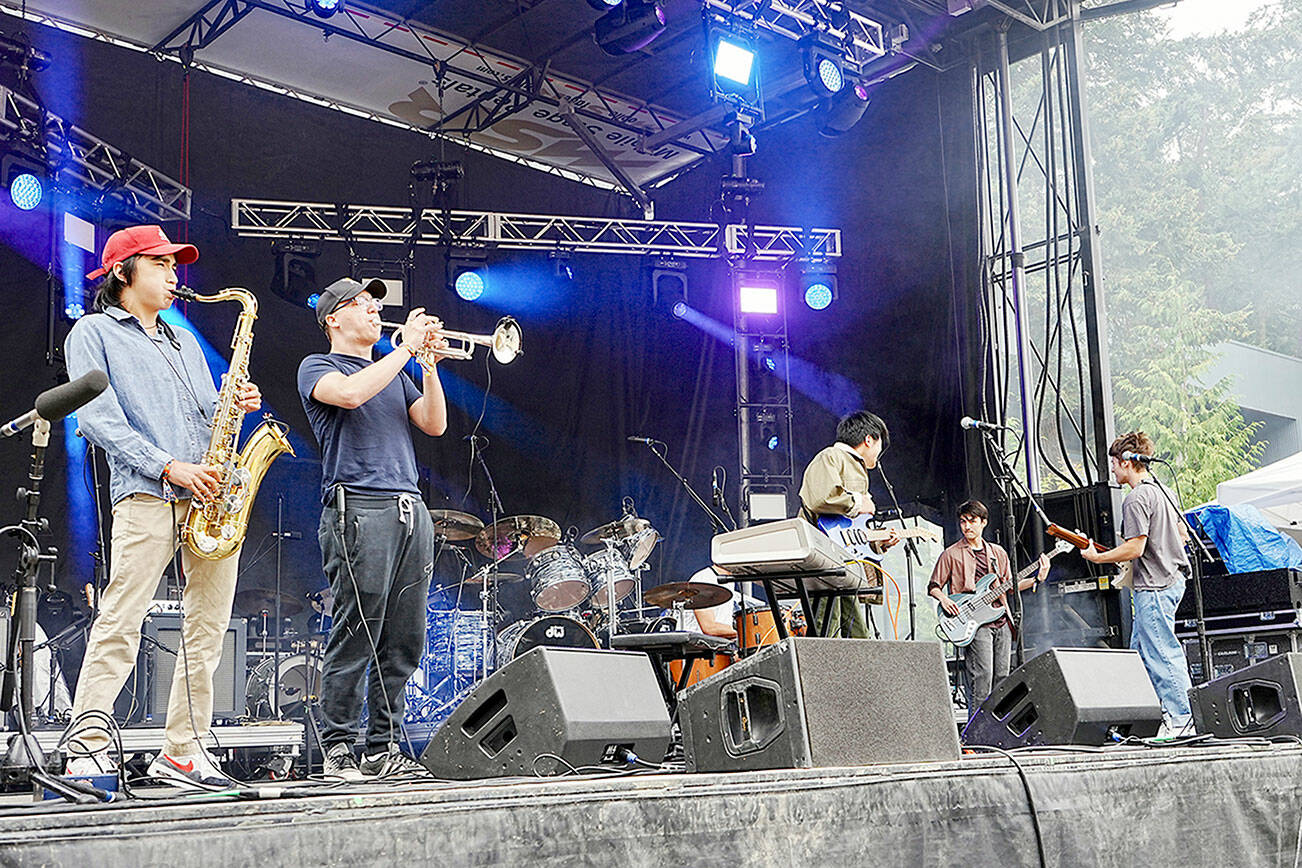 Steve Mullensky/for Peninsula Daily News

The band Aurora Avenue opens the THING Music and Arts Festival with a set played on Littlefield Green at Fort Worden State Park on Friday.