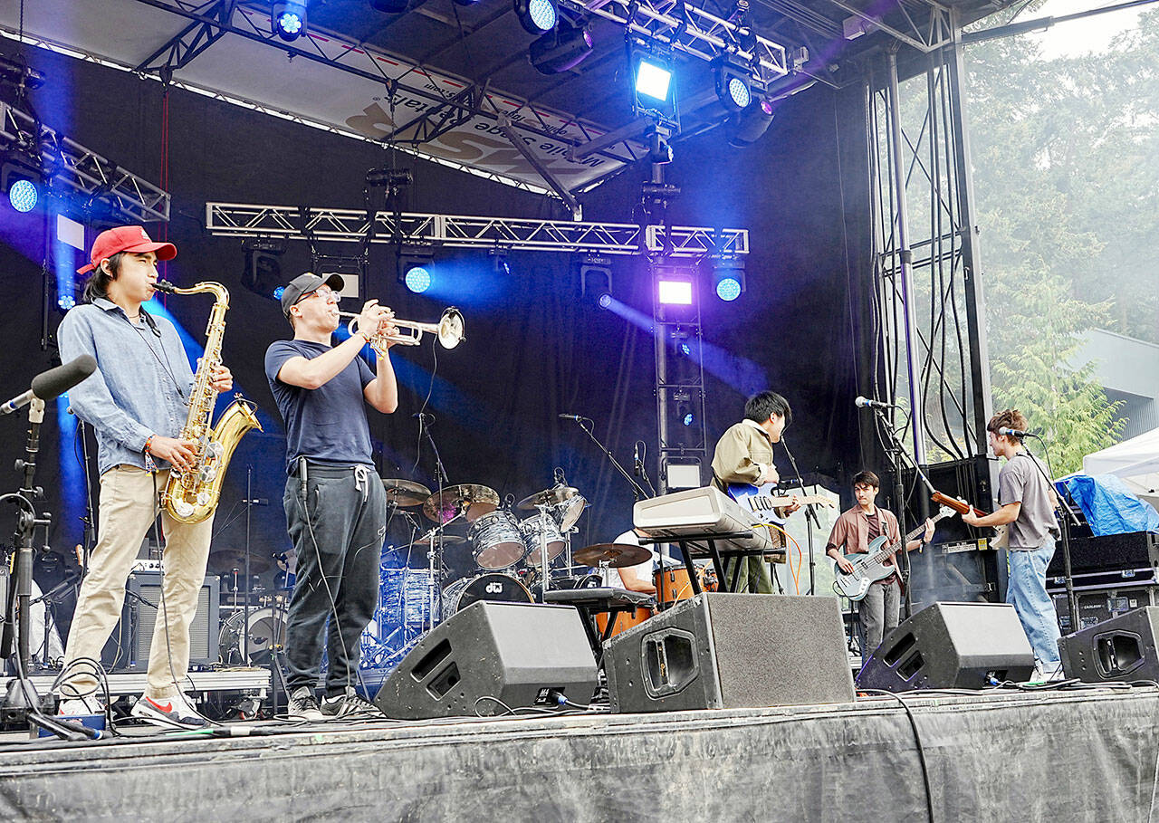 The band Aurora Avenue opens the THING Music and Arts Festival with a set played on Littlefield Green at Fort Worden State Park on Friday. (Steve Mullensky/for Peninsula Daily News)