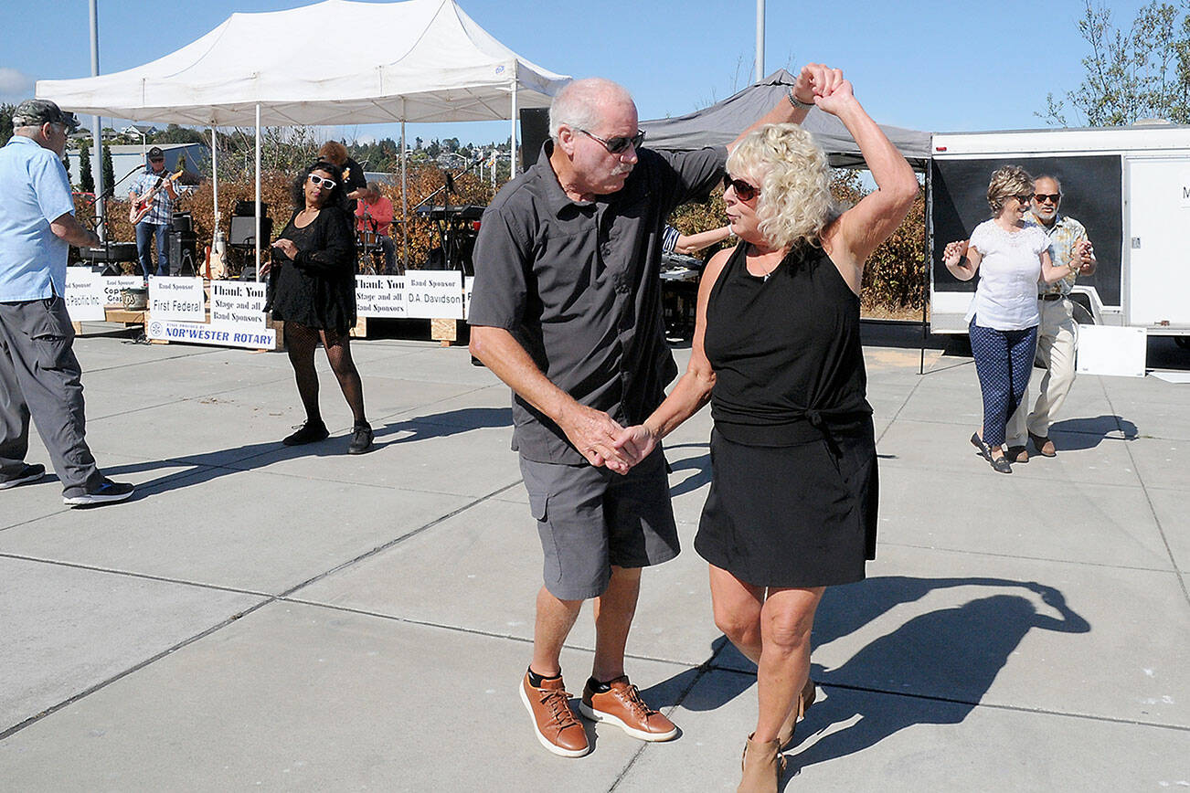 John and Freia Palmer of Port Angeles dance to the music of Sound Advice during Saturday’s Jammin’ in the Park at Pebble Beach Park on the Port Angeles waterfront. The event, hosted by the Nor’Wester Rotary Club, featured a day of music, food and a beer garden, as well as numerous informational displays. (Keith Thorpe/Peninsula Daily News)