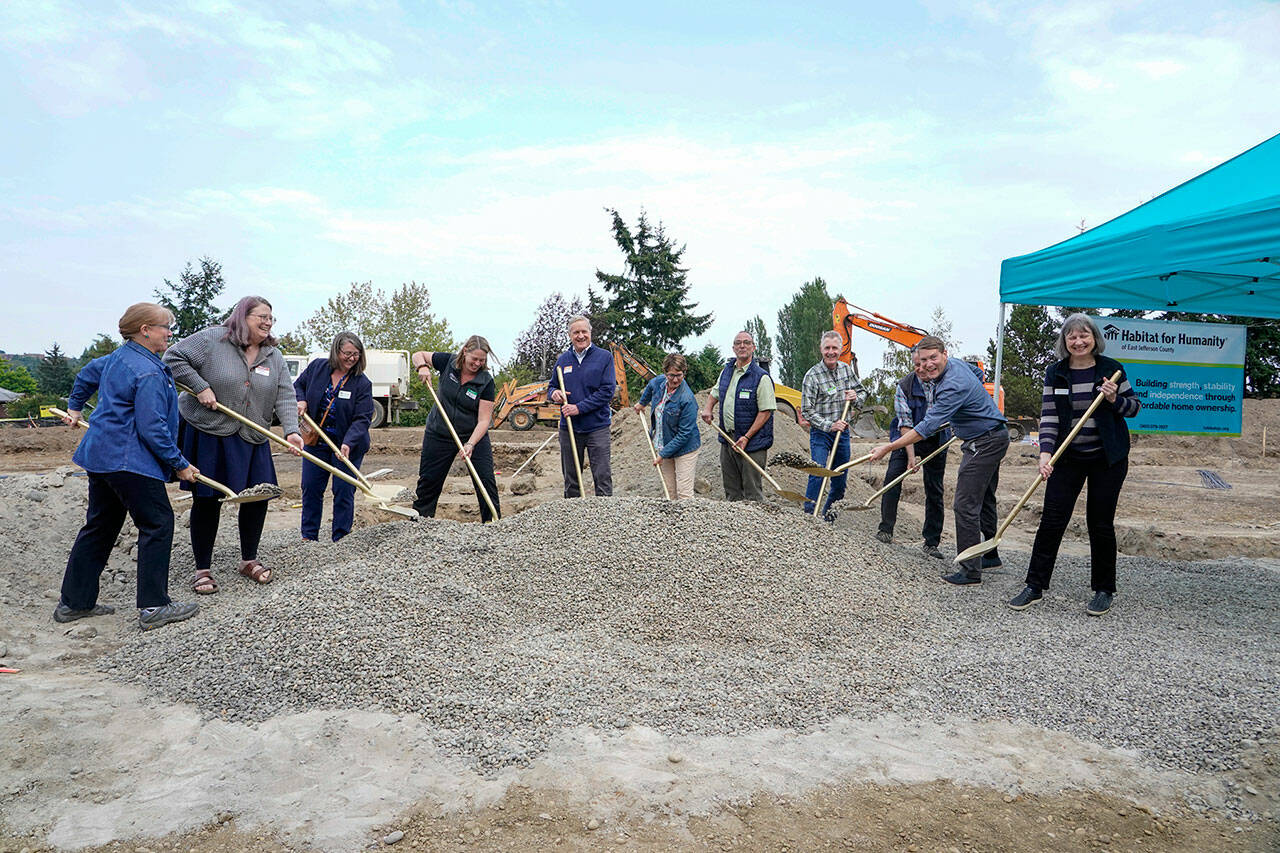 Port Townsend mayor David Faber, 2nd from the right, and other dignitaries shovel gravel to break ground on a 6 permanent, affordable housing project for Habitat for Humanity project at 18th and Landes Streets in Port Townsend on Wednesday. (Steve Mullensky/for Peninsula Daily News)