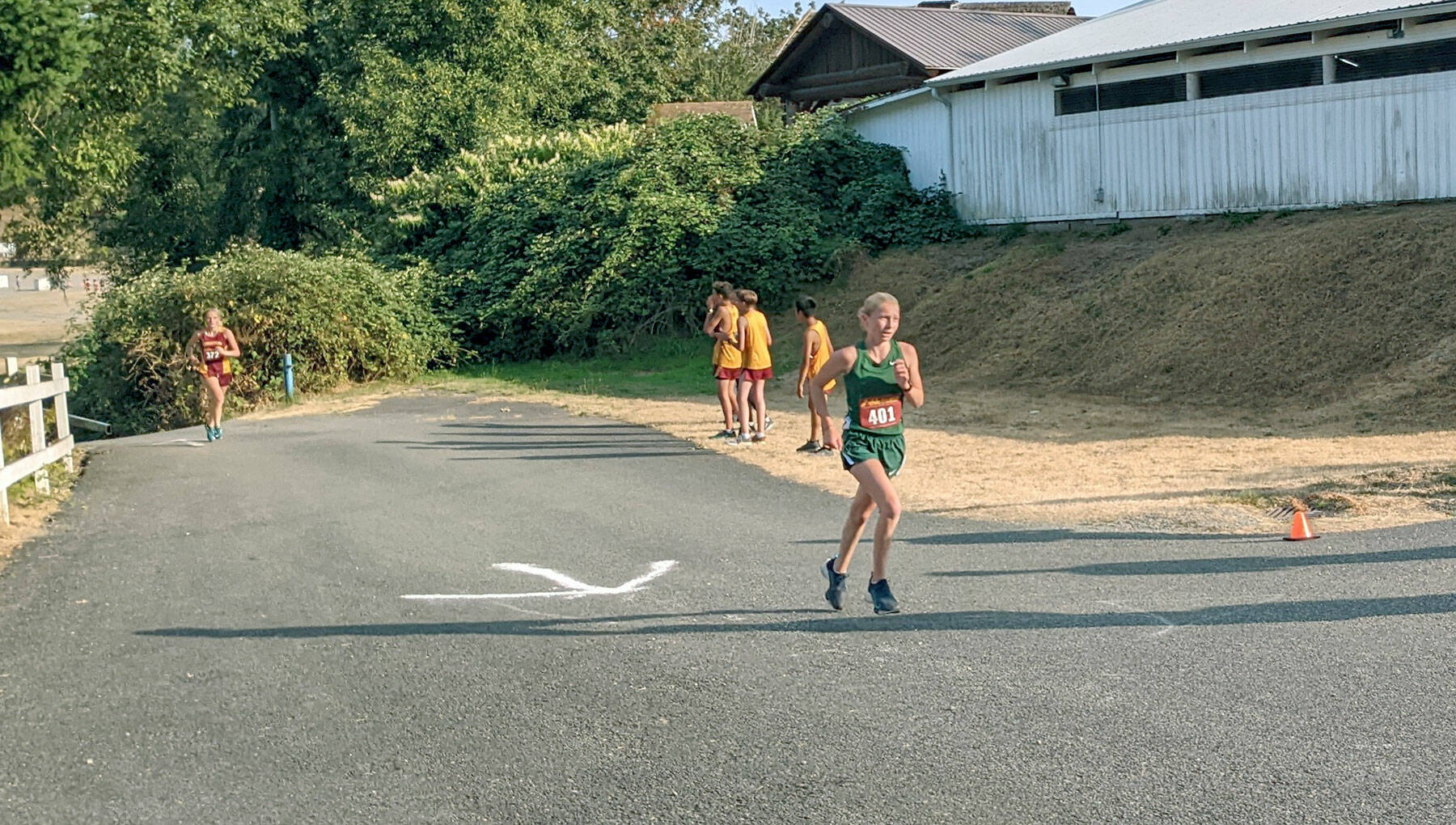 Port Angeles freshman Leia Larson runs up the final hill in a cross country meet at the Kitsap County Fairgrounds. Larson finished fourth in her first-ever varsity meet. (Rodger Johnson/Port Angeles Cross Country)