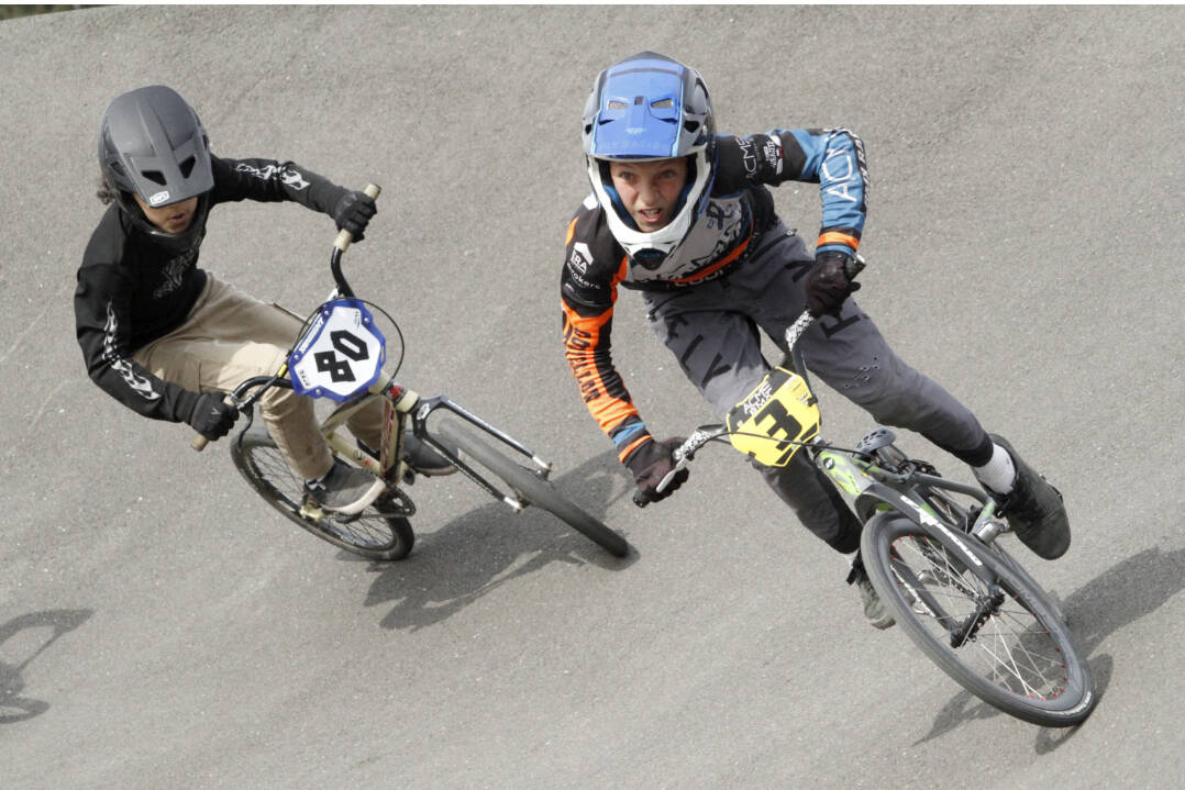 A pair of riders take on the high bank of the Lincoln Park BMX track Sunday at the USA BMX Pacific Northwest Gold Cup finals. (Courtesy of USA BMX/Craig Barrette)