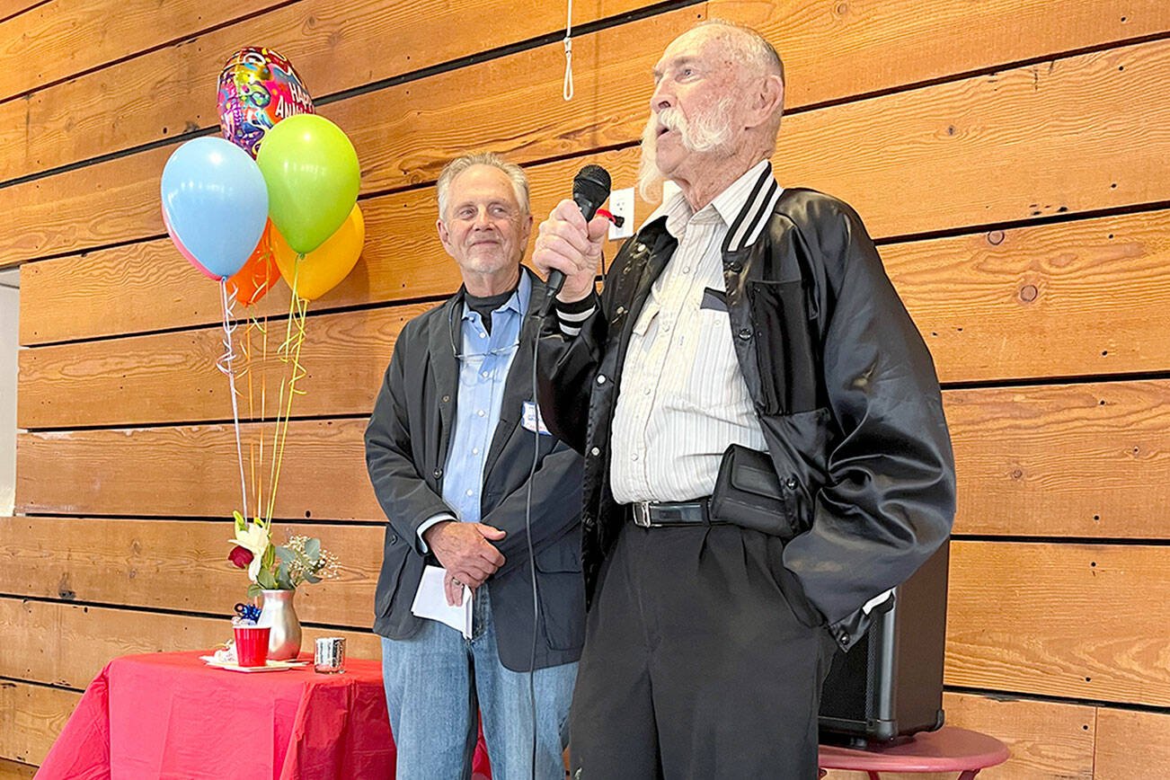 ECHHO chair David Whitney (left) listens as volunteer Roger Horner describes his experiences driving Jefferson County care receivers to their medical appointments at the non-profit organization’s 25th anniversary celebration. The  Port Townsend-based ECHHO (Ecumenical Christian Helping Hands Organization) has assisted more than 9,000 Jefferson County residents.