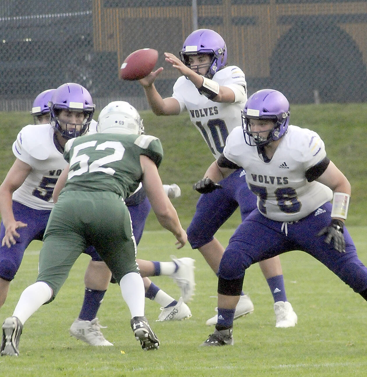 KEITH THORPE/PENINSULA DAILY NEWS
Sequim quarterback Lars Weiker receives the snap as linemen Ayden Holland, left, and XXXX XXXX (No. 78) defend against Port Angeles' Thomas Arand on Friday.