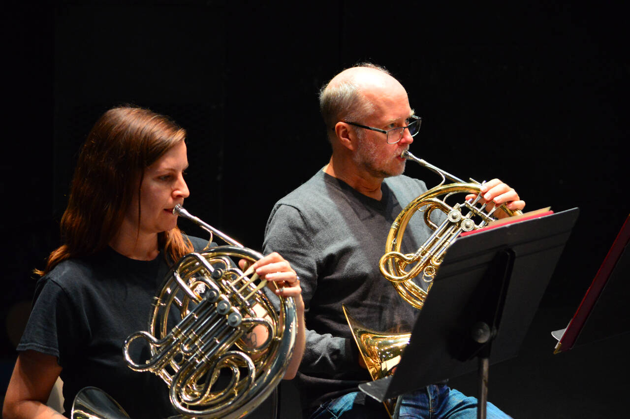 French horn players Kat Creekmore and Bruce Kelley rehearse for this Friday and Saturday’s Family Pops concerts at the Port Angeles High School Performing Arts Center. (Diane Urbani de la Paz)