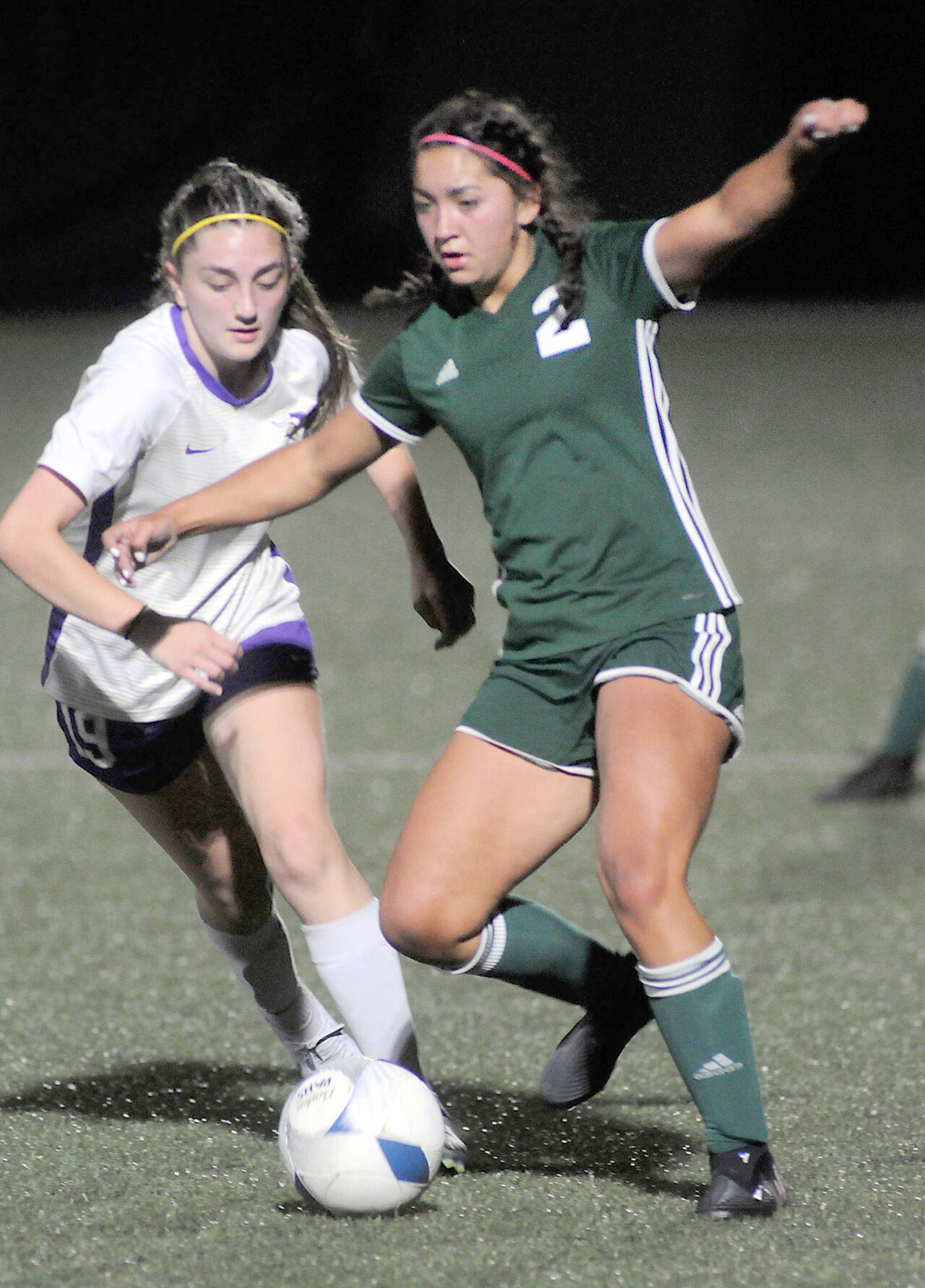 North Kitsap’s Jenna Clark, left, tries to defend against Port Angeles’ Piper Williams on Tuesday in Port Angeles. (Keith Thorpe/Peninsula Daily News)