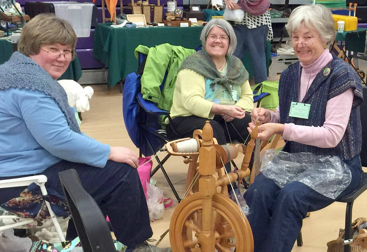 From left are Beth Witters, MarySue French and Susan Kroll at a spinning circle.
