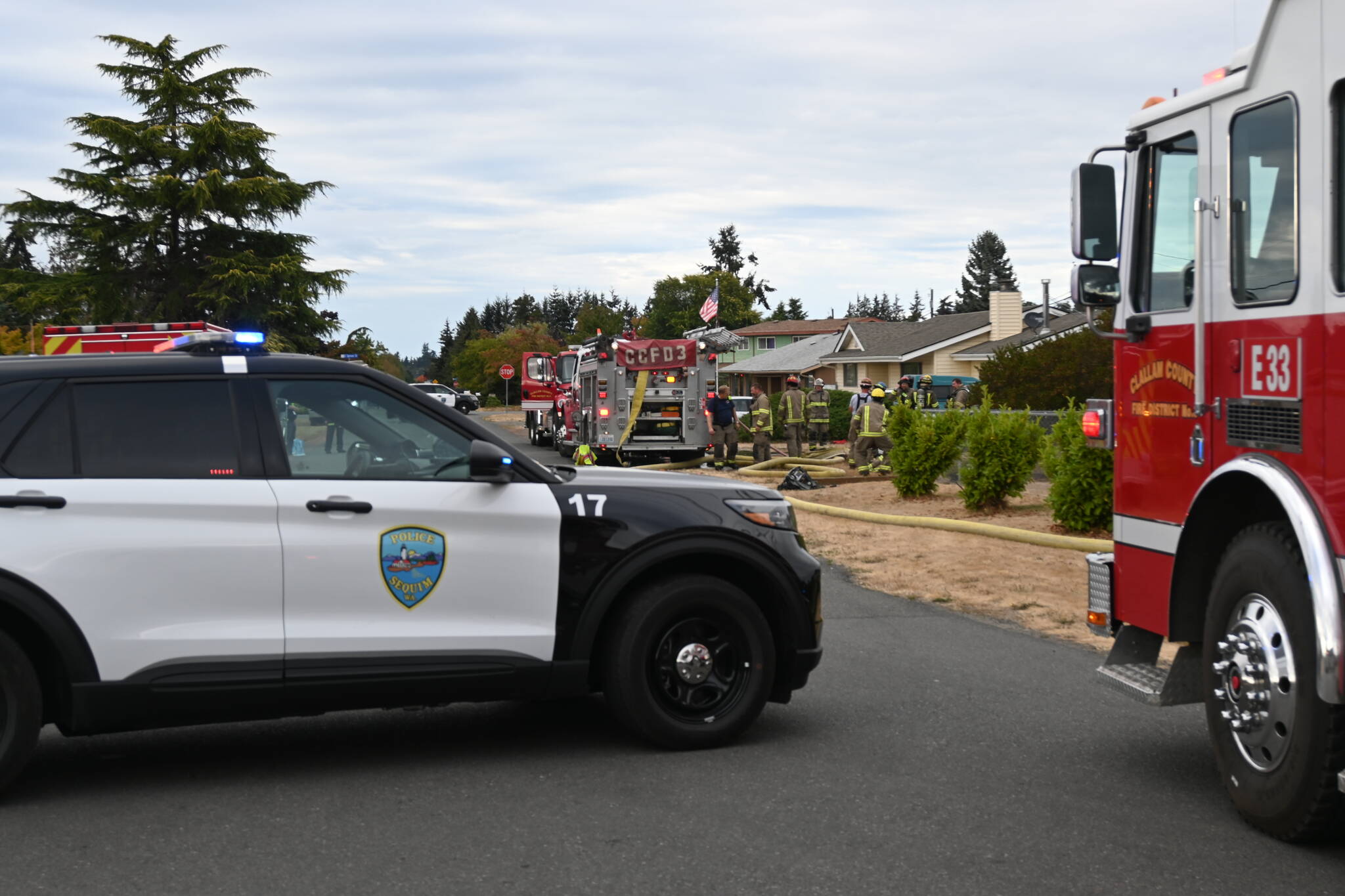 Firefighters from Clallam County Fire District 3 respond to a house fire on the 200 block of North Dunlap Avenue. (Michael Dashiell/Olympic Peninsual News Group)
