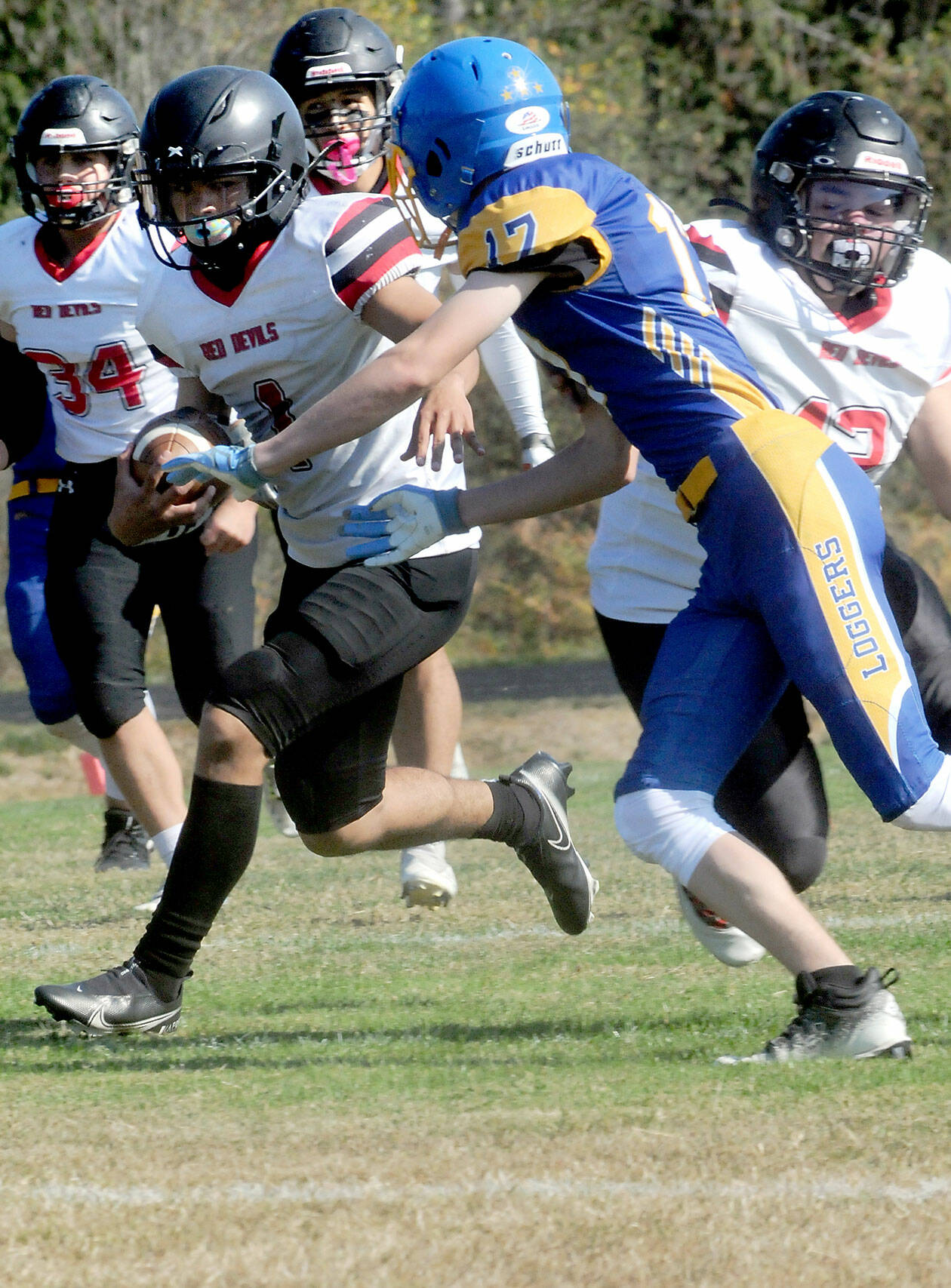 Neah Bay’s Jodell Wimberly, left, tries to evade the defense of Crescent’s Lucas Love on Saturday in Joyce. (Keith Thorpe/Peninsula Daily News)