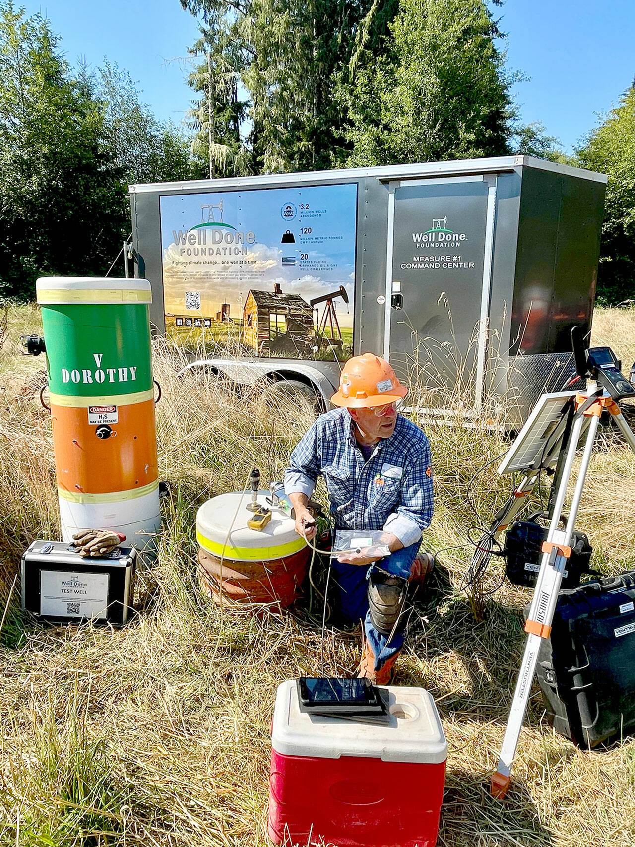 Curtis Shuck, chairman of the Well Done Foundation, a non-profit organization that works to cap abandoned oil and gas wells, conducts testing on a well in West Jefferson County. The well, located near the Hoh River in an area known as Oil City, is leaking emissions, and Shucks foundation is working to properly seal it. (Well Done Foundation)